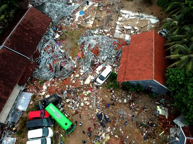 An aerial photo shows damaged buildings in Carita