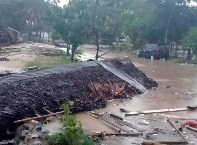 A destroyed house and flooded streets in Banten, Indonesia. Photo: 23 December 2018