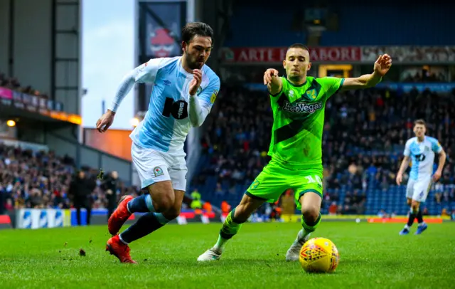 Bradley Dack slips past Norwich's Moritz Leitner