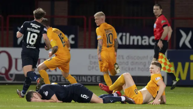 Dundee's Darren O'Dea clashes with Livingston's Jack Hamilton