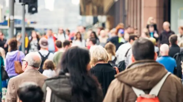 people in busy street