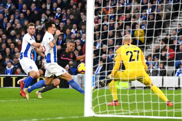 Richarlison shoots against Brighton