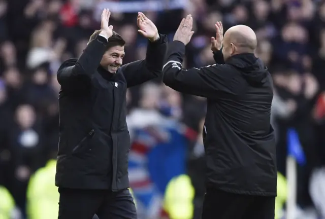 Steven Gerrard celebrates with assistant manager Gary McAllister at full-time