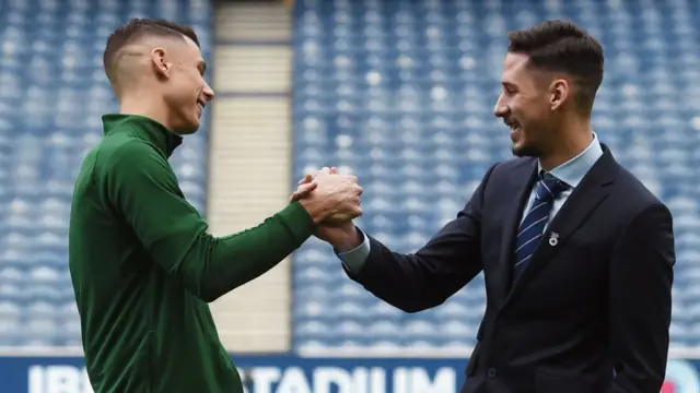 Celtic's Filip Benkovic and Rangers' Nikola Katic shake hands