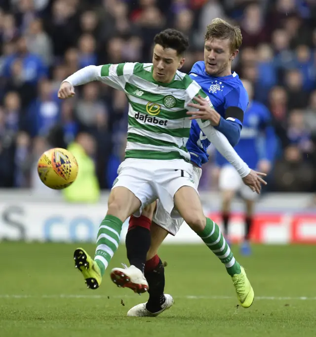 Mikey Johnston holds off Rangers' Joe Worrall