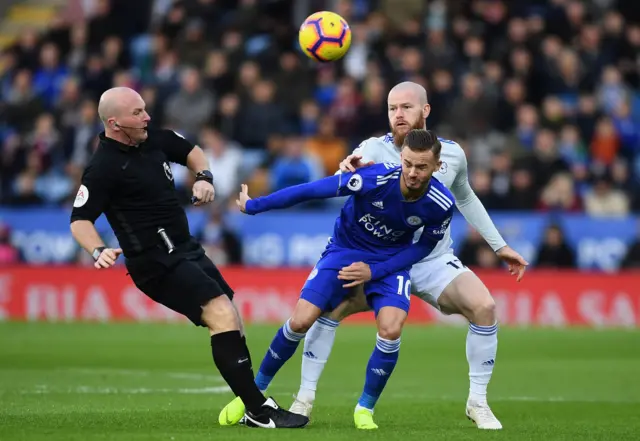 Referee Simon Hooper and Leicester's James Maddison