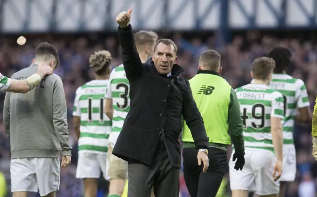 Celtic boss Brendan Rodgers salutes the small band of away fans at Ibrox