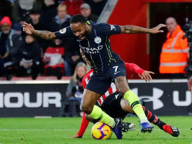 Raheem Sterling tackled