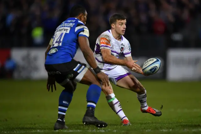 George Ford of Leicester Tigers offloads under pressure from Semesa Rokoduguni of Bath