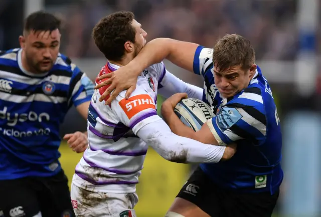 Tom Ellis of Bath is tackled by Jonah Holmes of Leicester Tigers