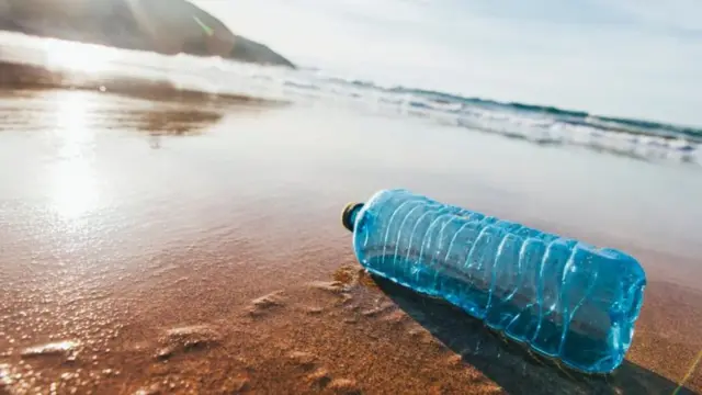 A plastic bottle on the beach