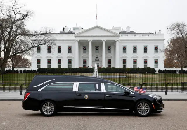 The hearse passes the White House