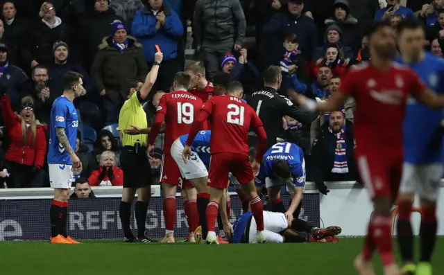 Aberdeen striker Sam Cosgrove receives his marching orders at Ibrox