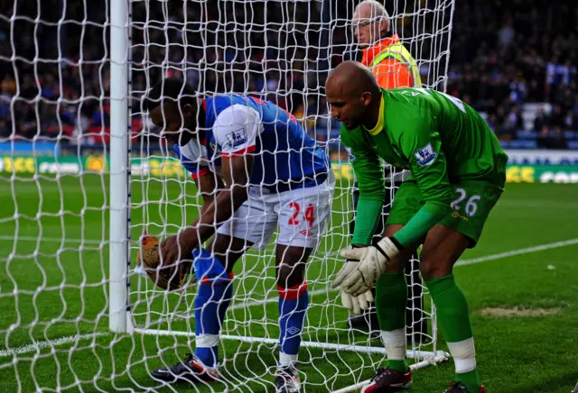 Yakubu holds a chicken