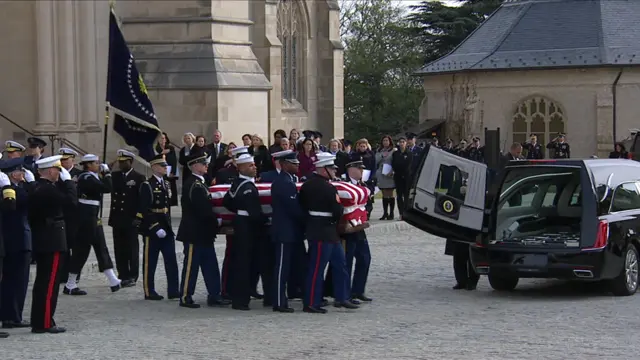 Casket carried to hearse