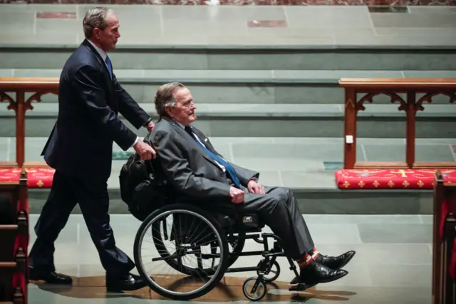 Former president George W. Bush, left, wheels his father, former president George H.W. Bush into the church for the funeral for former first lady Barbara Bush at St. Martin's Episcopal Church on April 21, 2018 in Houston, Texas. Bush, wife of former president George H. W. Bush and mother of former president George W. Bush, died at her home in Houston on April 17 at the age of 92. (Photo by Brett Coomer - Pool/Getty Images)