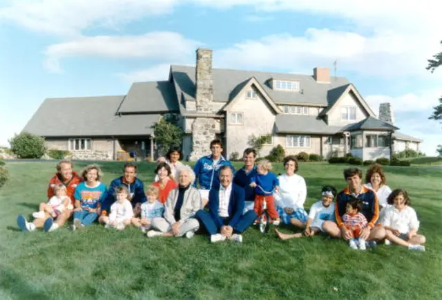 Portrait of the large Bush family in front of their Kennebunkport, Maine home.