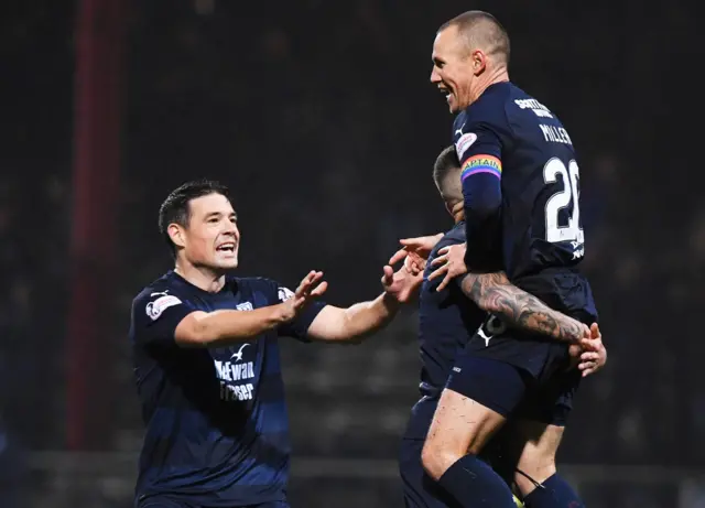 Kenny Miller (right) celebrates giving Dundee the lead at Dens Park