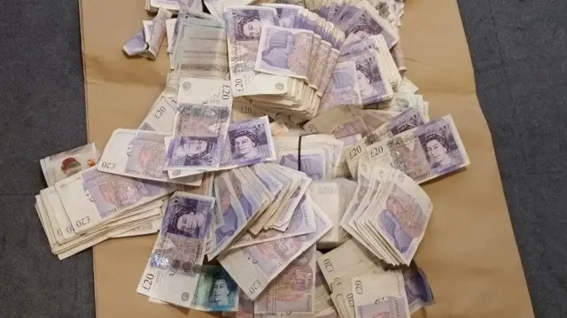 Some of the money seized today by police