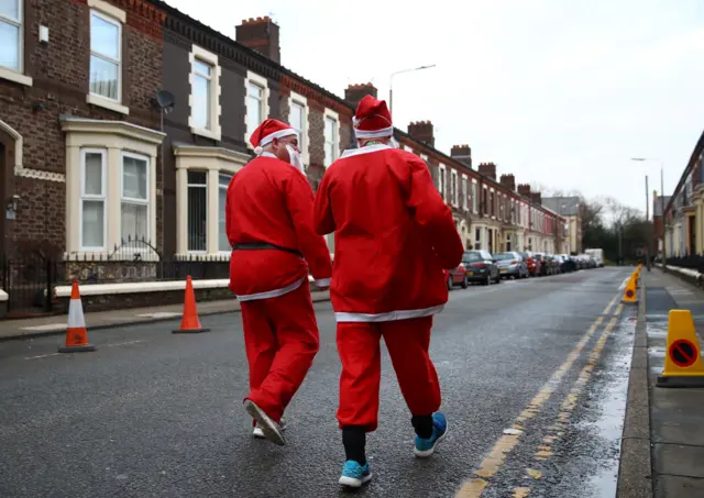 Premier League fans dressed as Santa