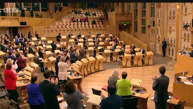 MSPs give a standing ovation to all the women in the gallery