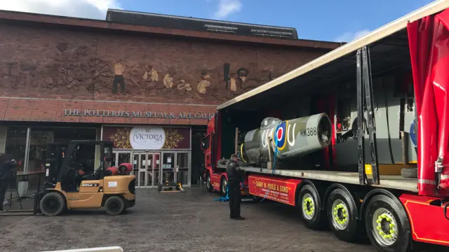 Spitfire loaded on lorry