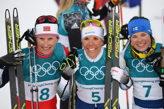 Gold medalist Charlotte Kalla, centre, and the other two medal winners