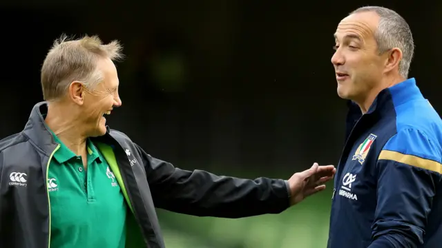 Ireland coach Joe Schmidt shares a pre-match joke with Italy counterpart Conor O'Shea