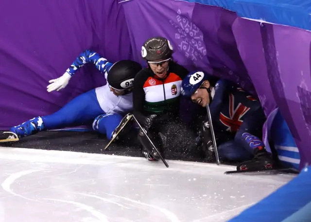 Charlotte Gilmartin of Great Britain involved in a crash in the short track speed skating.