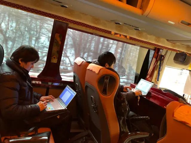 The media are busy working on the bus at the Winter Olympics