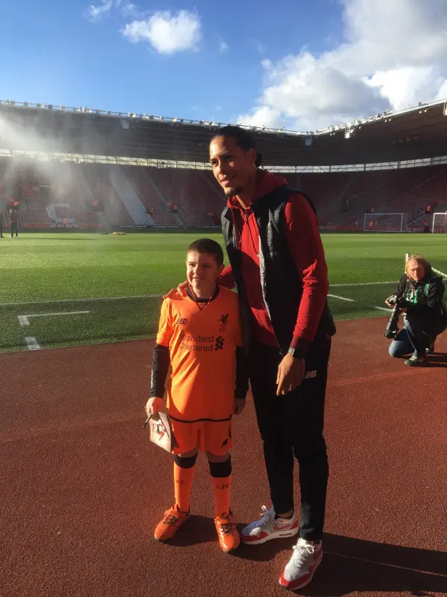 Virgil van Dijk poses with fan