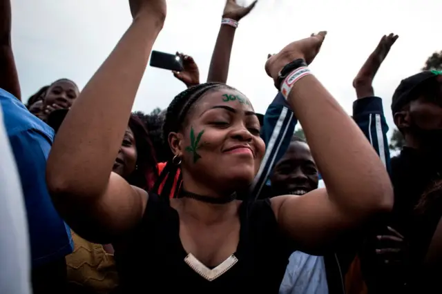 Congolese festival-goers dance during the Amani Festival on February 10, 2018 in Goma. The Amami Festival runs from Febraury 9 to 11, promoting peace and culture in eastern Democratic Republic of Congo and Great Lakes region.