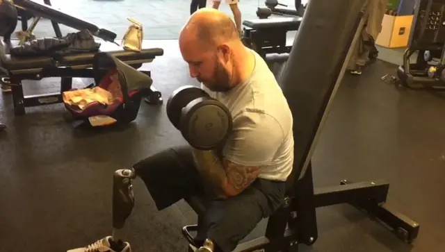 Former soldier lifting weights in Cannock