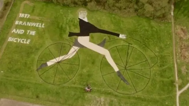 Branwell Bronte riding a bicycle