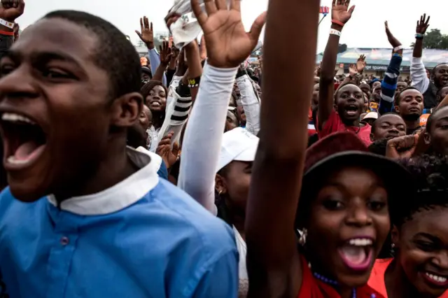 Congolese festival-goers cheer and dance during the Amani Festival on February 10, 2018 in Goma. The Amami Festival runs from Febraury 9 to 11, promoting peace and culture in eastern Democratic Republic of Congo and Great Lakes region.