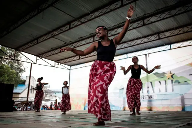 A traditional Congolese dance group performs on stage during the Amani Festival on February 10, 2018 in Goma. The Amami Festival runs from Febraury 9 to 11, promoting peace and culture in eastern Democratic Republic of Congo and Great Lakes region.