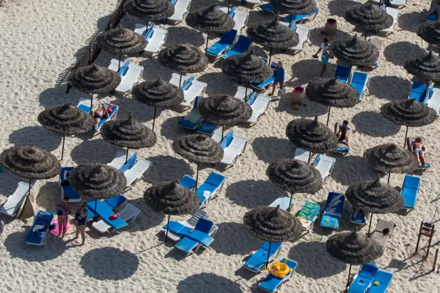 Tourists enjoy the beach on June 25, 2016 in Sousse, Tunisia