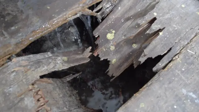 Hole in wooden floor