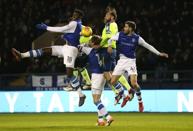 Sheffield Wednesday and Derby County players battle for the ball