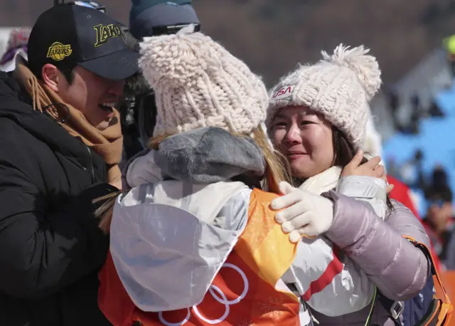 Chloe Kim celebrates with her parents