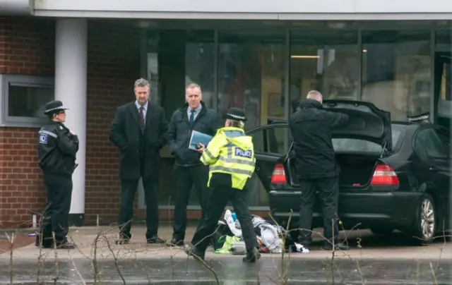 Police next to vehicle