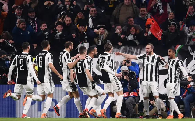 Juventus players celebrate their second goal