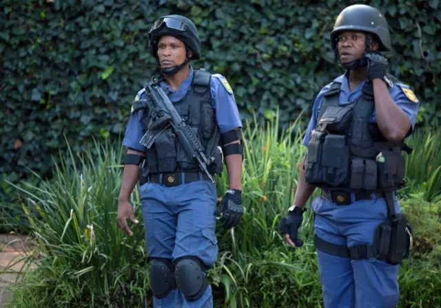 Police close off roads around the home of the Gupta family, friends of President Jacob Zuma, in Johannesburg, South Africa, February 14, 2018.