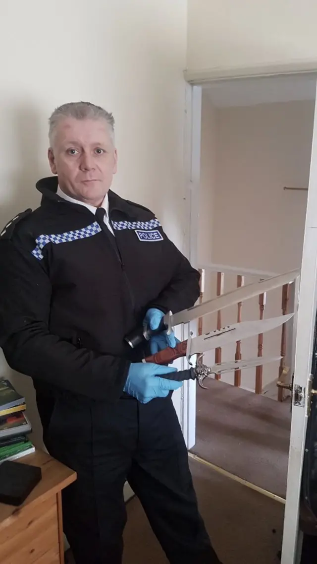 Officer with knives