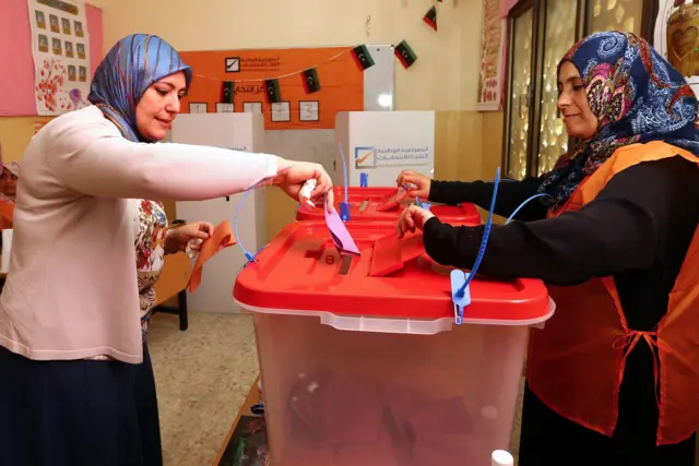 A Libyan woman casts her ballot at a polling station during legislative elections in the capital Tripoli on June 25, 2014. Polling was under way across Libya in a general election seen as crucial for the future of a country hit by months of political chaos and growing unrest. Voters are choosing from among 1,628 candidates, with 32 seats in the 200-strong General National Congress reserved for women and would-be MPs banned from belonging to any political party.