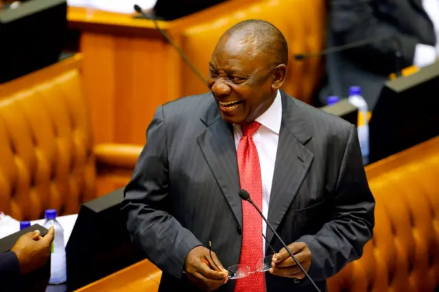 Acting President of South Africa Cyril Ramaphosa reacts as he arrives at Parliament in Cape Town, on February 15, 2018 for a session to officially deal with former President Zuma's resignation and his possible election and swearing.