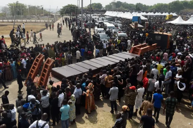 Coffins arrive at Ibrahim Babanginda Square in the Benue State capital Makurdi, on January 11, 2018, during a funeral service for scores who died following clashes between Fulani herdsmen and natives of Guma and Logo districts.