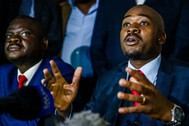 Zimbabwe opposition party Movement for Democratic Change (MDC) acting President Nelson Chamisa (R) speaks during a press conference at Harvest House, the party headquarters, in Harare February 15, 2018 following the death of the veteran opposition leader. Zimbabwe was plunged into grief on February 15 following the death of veteran opposition leader Morgan Tsvangirai, roundly praised as a hero, champion of democracy and symbol of resistance who will be hard to replace.