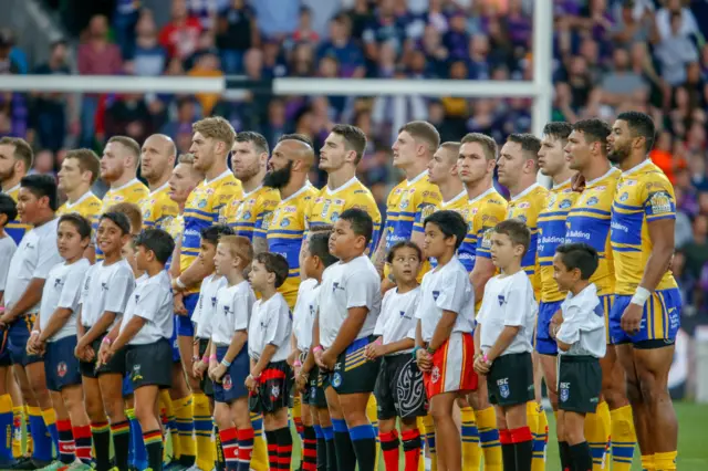 Leeds players sing the national anthem