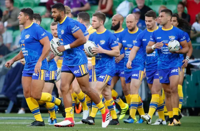 Kallum Watkins leads out Leeds Rhinos